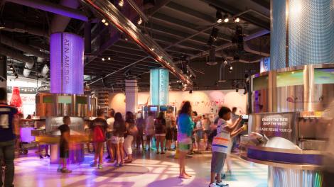 Visitors exploring the Taste It! Exhibit at World of Coca-Cola 