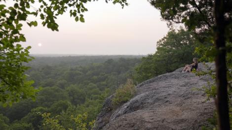 Watching the sunrise from an overlook in Chickasaw National Recreation Area in Oklahoma Watching the sunrise from an overlook in Chickasaw National Recreation Area in Oklahoma