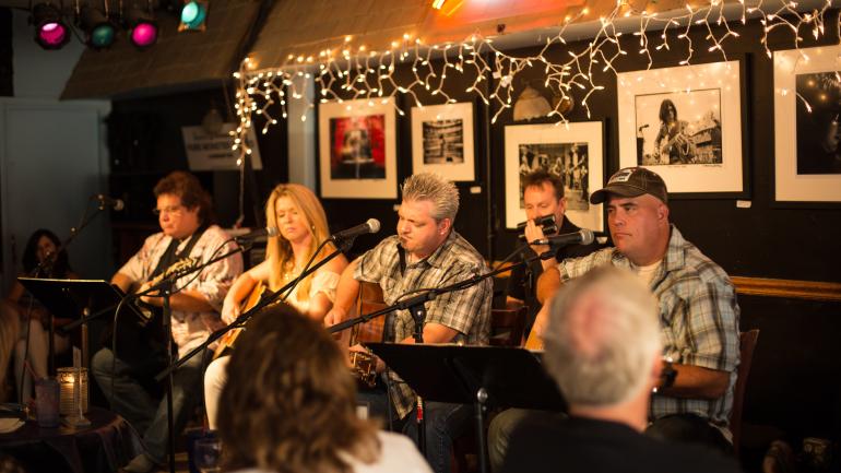 Listening to music in the popular Bluebird Cafe in Nashville Listening to music in the popular Bluebird Cafe in Nashville