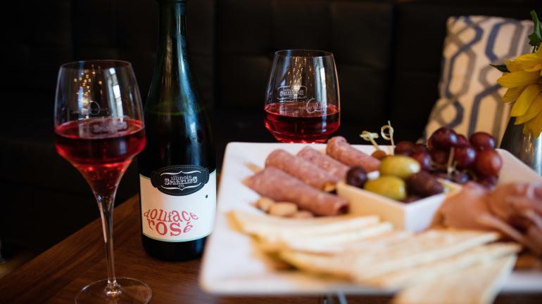 A charcuterie plate pairs well with Illinois Sparkling Co. rosé at the tasting room in North Utica A charcuterie plate pairs well with Illinois Sparkling Co. rosé at the tasting room in North Utica