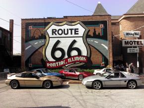 Antique Pontiac Fieros parked in front of the Route 66 mural at the Route 66 Hall of Fame & Museum Antique Pontiac Fieros parked in front of the Route 66 mural at the Route 66 Hall of Fame & Museum
