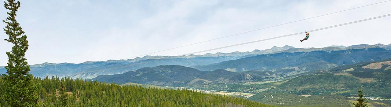 Zip lining above the forest surrounding Breckenridge Zip lining above the forest surrounding Breckenridge