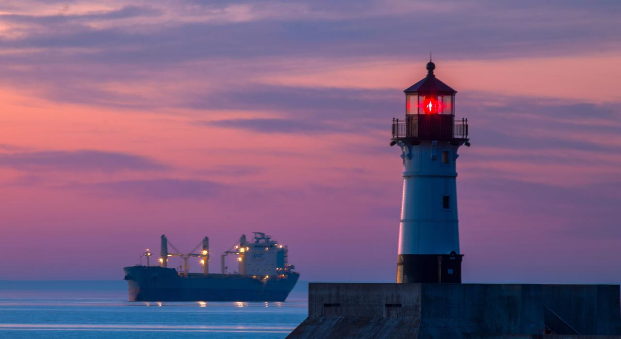 Sunrise paints the harbor while North Pier Lighthouse looks on Sunrise paints the harbor while North Pier Lighthouse looks on
