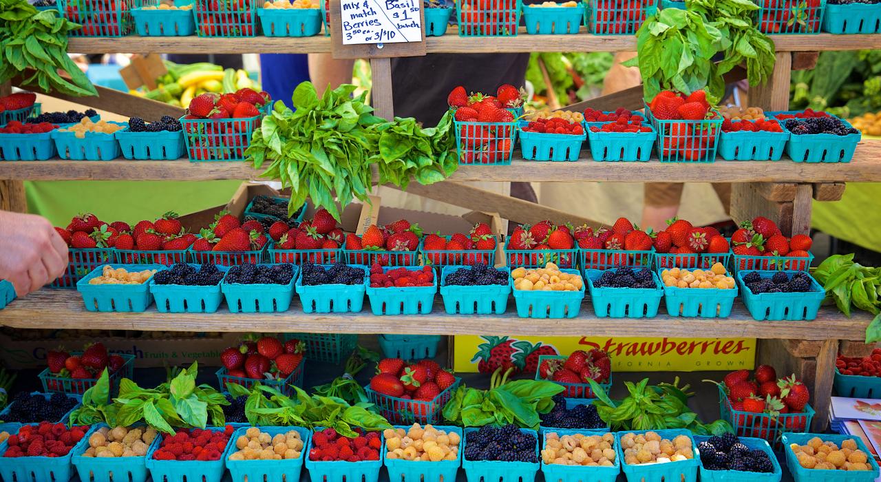Sweet and juicy strawberries, the biggest local commercial crop, at a farmers' market Sweet and juicy strawberries, the biggest local commercial crop, at a farmers' market