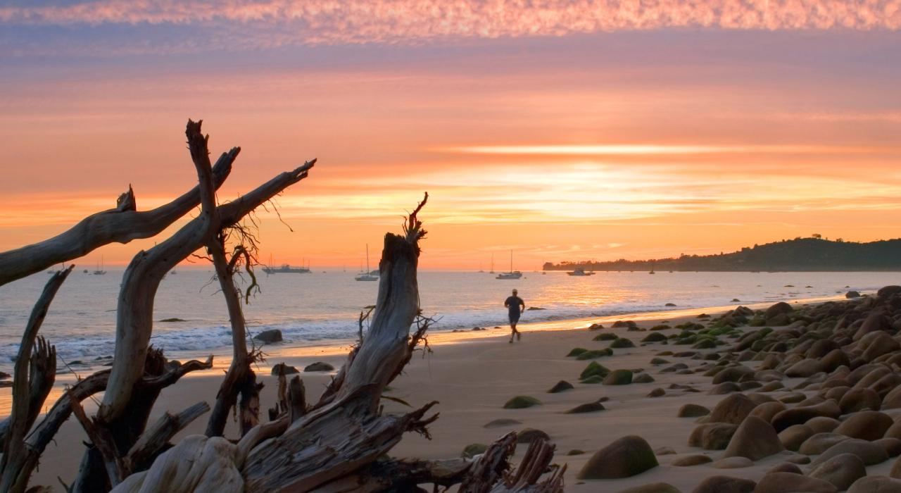 Jogging at sunset along the shoreline Jogging at sunset along the shoreline