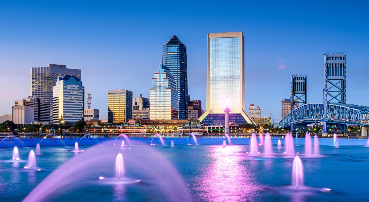 The city skyline framed by Friendship Fountain at St. Johns River Park The city skyline framed by Friendship Fountain at St. Johns River Park