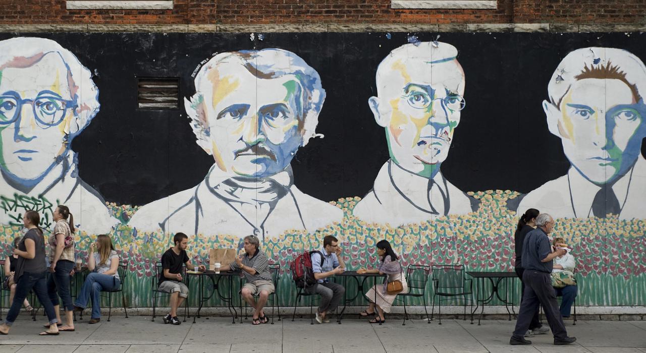 Chatting in the shadows of giants depicted in The Bookstore Mural Chatting in the shadows of giants depicted in The Bookstore Mural
