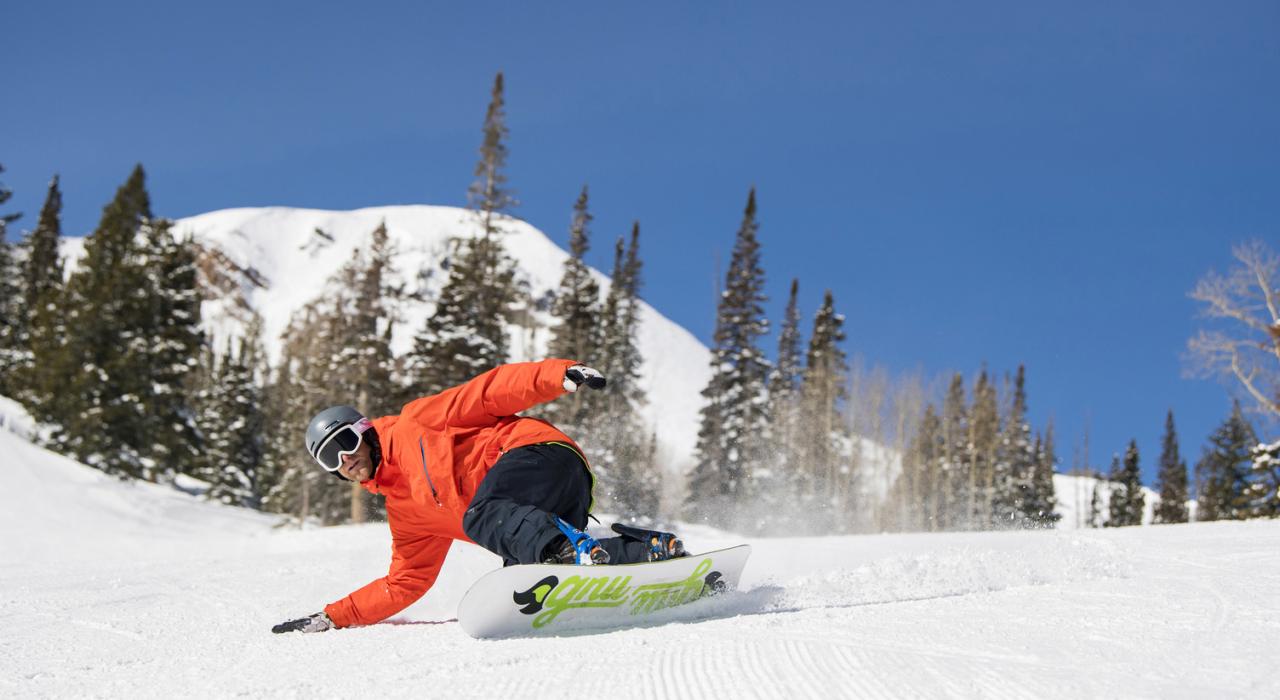 Snowboarding on a perfectly groomed slope Snowboarding on a perfectly groomed slope