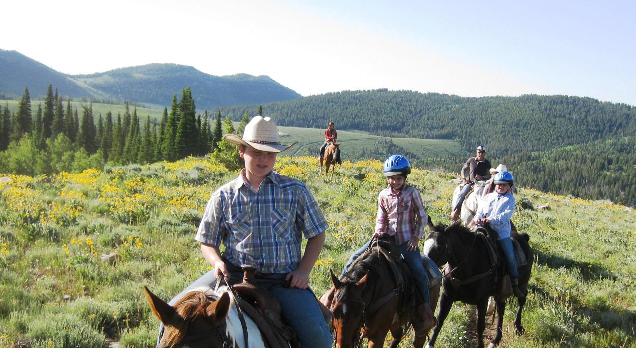 Family horseback riding trip in Logan Canyon