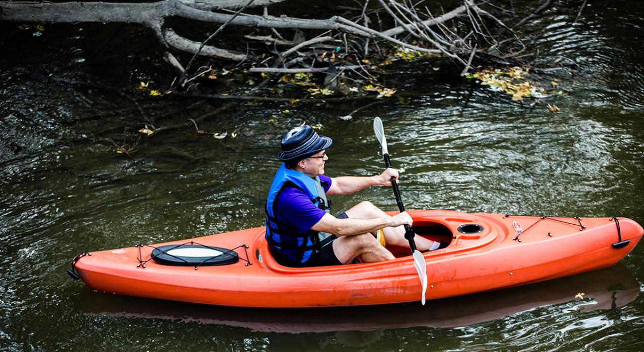 Kayaking in a picturesque creek in the Village of Brookfield Kayaking in a picturesque creek in the Village of Brookfield