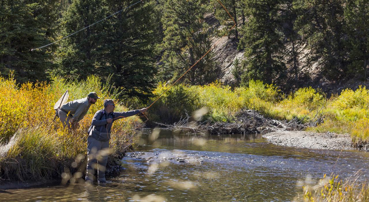 Fly-fishing anglers seeking to hook prize-winning trout Fly-fishing anglers seeking to hook prize-winning trout